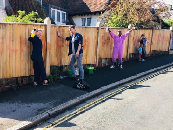 Lewes residents scrubbing off the graffiti on Saturday