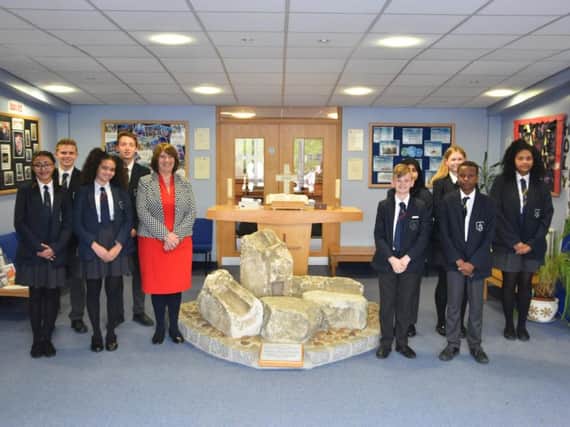 Headteacher Rev. Chrissie Millwood and students at Holy Trinity School