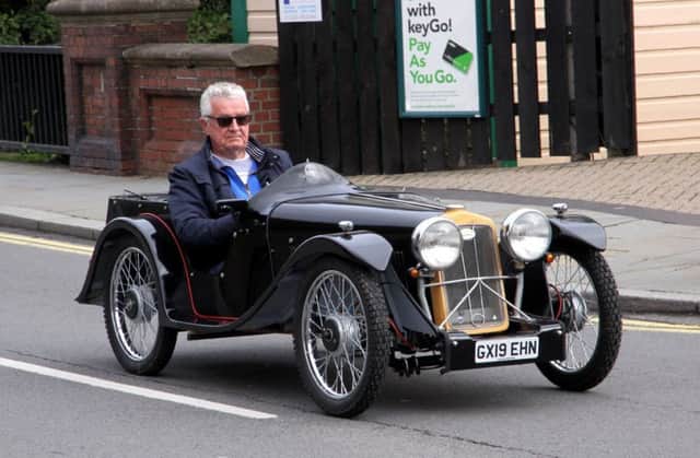 A swish classic car makes its way down Uckfield High Street photo by Ron Hill