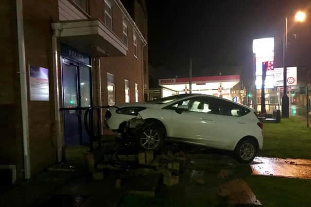 A car collided with railings and a disabled ramp at the entrance to the police stationonA286 Bepton Road. Photo: Phil Bowell