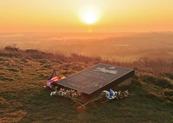 The sun rising over the Ruth-Less war memorial on Butts Brow, by Barry Davis. This photograph of the memorial to the American airmen who died when their aircraft crashed into the South Downs during World War Two was taken with a Canon 5d iii. SUS-190803-104422001