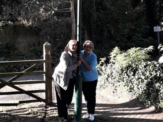 Maggie Lupton (left), member of the Friends of Old Rectory Gardens group, with Joyce Pritchard, chairman of Felpham Village Conservation Society after the lights in Old Rectory Gardens were switched on after four years of being out of action.