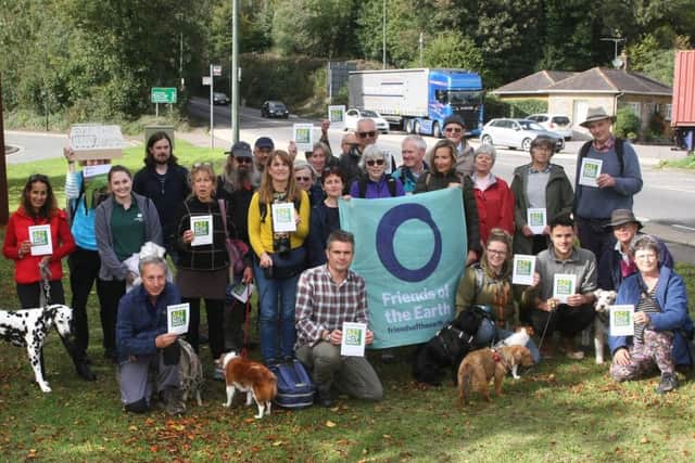 DM19101831a.jpg. Arundel Bypass: Friends of the Earth continues challenge to scheme, and calls for Highways England to be scrapped. Friends of the Earths Chief Executive, Craig Bennett and supporters beside the A27 in Arundel. Photo by Derek Martin Photography.