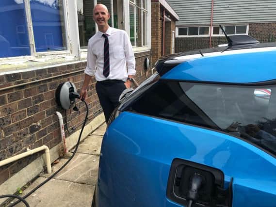 Matthew Andrews, deputy headteacher at Three Bridges Primary School, at one of the chargepoints