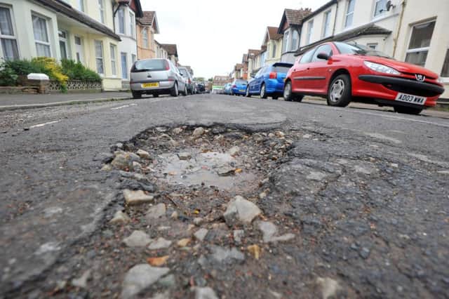 12/6/13- Potholes in Sidley Street, Bexhill. ENGPNL00120140130143649