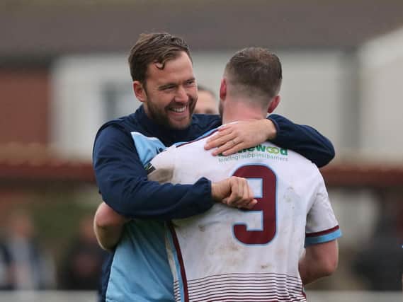 Chris Agutter celebrates with goalscorer Ben Pope. Picture by Scott White