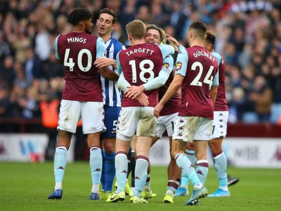 Aston Villa celebrate their late winner against Brighton and Hove Albion at Villa Park