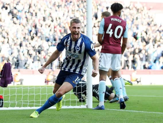 Brighton and Hove Albion defender Adam Webster celebrates his first goal for the club and the opener during a 2-1 loss at Aston Villa.