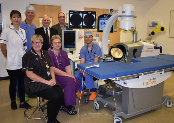Urology staff with the lithotripter along with Simon Mackie and Bob Lewis from the Medi Tech Trust SUS-191021-113125001