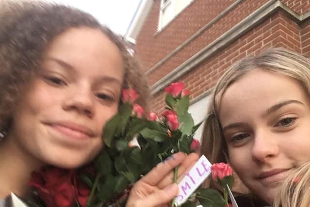 Izzy Withers and Maddie Clark spent their pocket money on roses for the public