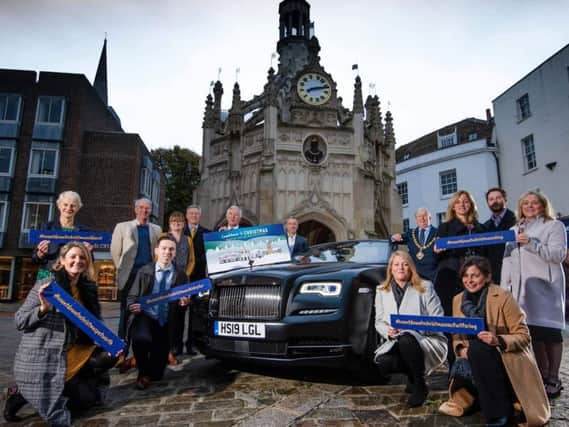 Councils, organisations and local media organisations gather at the Market Cross with a Rolls Royce car to launch the campaign.
