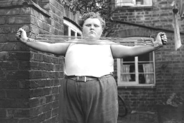 circa 1940:  15-year-old Billie Barton, of Earls Barton, Northampshire, has gained another stone in weight in the last year in the hope of appearing in a film of Billy Bunter's Schooldays. The 18 stone youngster is seen here in training for the part.  (Photo by Fox Photos/Getty Images) SUS-190111-110709001
