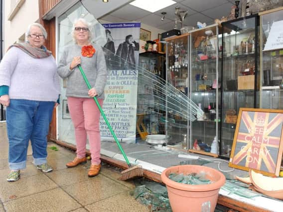 Emsworth Antiques Etc, in West Street, Emsworth, had a car reverse into their shop window on Monday, November 4.......Pictured is: (l-r) Hilary Bolt, owner and Lisa Marie Wood, shopkeeper.......Picture: Sarah Standing (041119-1085)