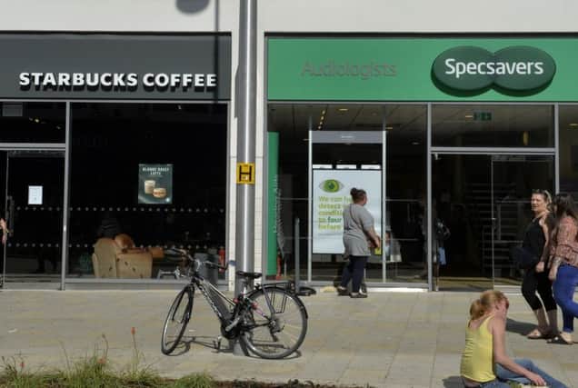 STARBUCKS and Specsavers in Terminus Road, Eastbourne (Photo by Jon Rigby) SUS-190919-105713008