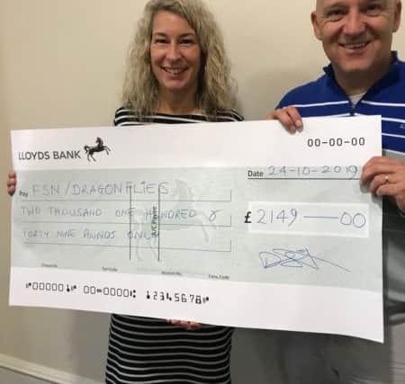 Angie Jakeman, from Dragonflies, accepted the cheque from Darren