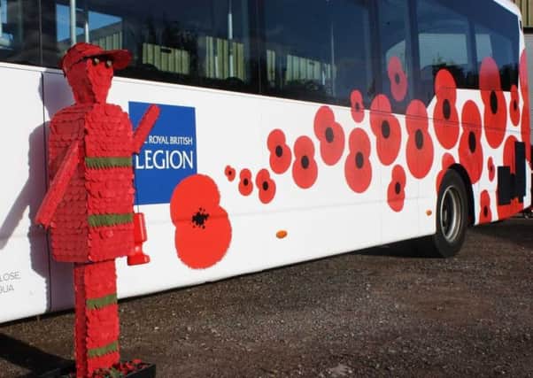 The Brighton & Hove Buses poppy bus with a poppy covered soldier scultpure. The bus company will offer free travel to veterans and serving members of the armed forces this Remembrance Sunday (November 10).