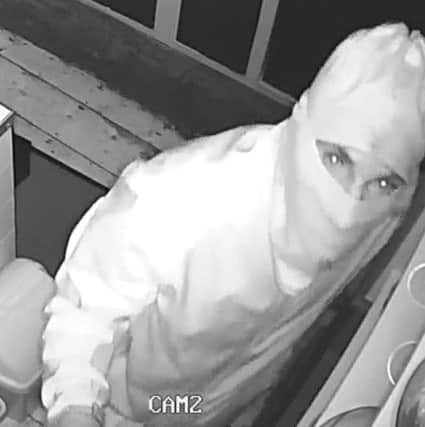 One of the CCTV  images released by the Seaford cafe