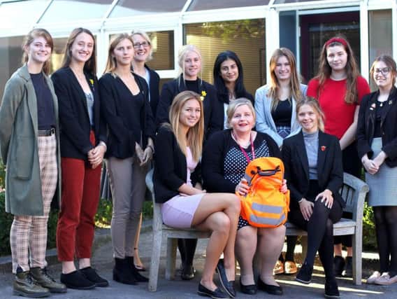 Donna Ockenden (seated), Mrs Taylor (standing, head of charities at Portsmouth High School) and sixth form house captains and deputy house captains