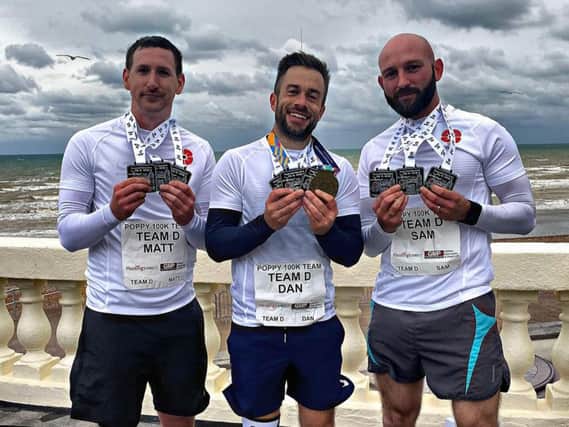 Matt Roberts (left), Dan Foreman (centre) and Sam Harman celebrate their sucess after completing the Poppy 100k run. Picture courtesy of Dan Foreman