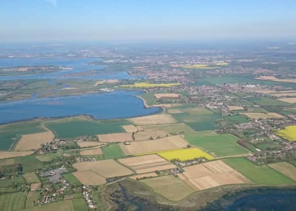 An aerial photograph of the top of Chichester Harbour and the A259 corridor