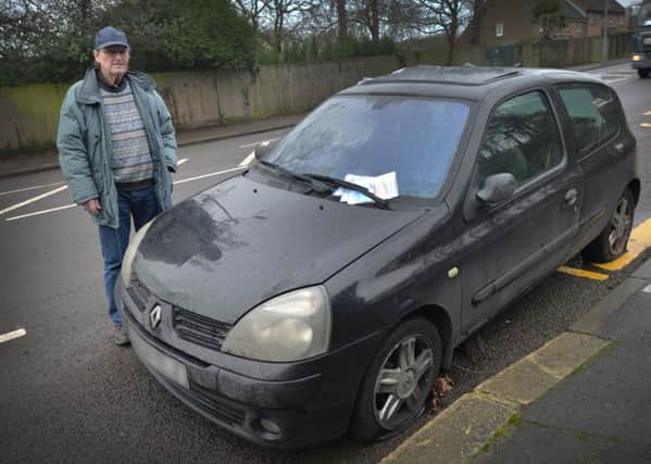 Leonard Chapell pictured with the abandoned car in Sedlescombe Road North