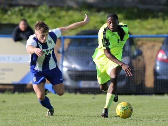 Lanre Azeez in action for Hastings United at Haywards Heath Townearlier in the season. Picture by Scott White