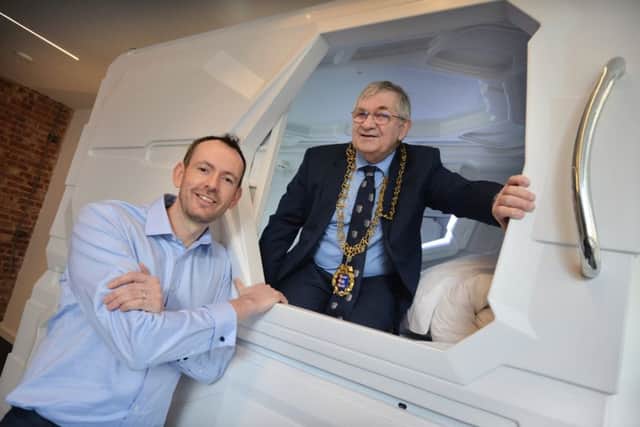 The mayor of Hastings, councillor Nigel Sinden, "tops out" Pod Central in St Leonards. The mayor is pictured with Bryan O'Lynn, managing director of Pod Central. SUS-201102-120036001