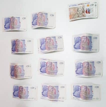 Cash totalling £1,600 was seized from Hodgins' house. Picture: Sussex Police