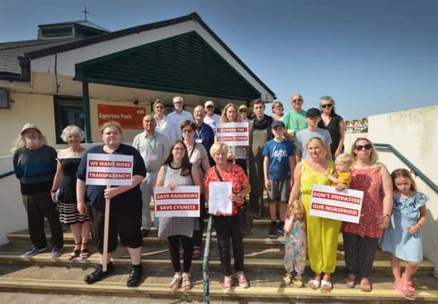 Pictured are campaigners last summer fighting to save two nurseries handing in a petition to the children's centre in Egerton Road, Bexhill, where Cygnets is located. SUS-190723-164009001