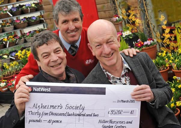 JPCT 010313 £35,175 Presented to Charity as Hillier Garden Centre starts celebration weekend. L to R TV actor Richard Hawley, star of the BBC series The Vet, Terry Clarke, garden centre manager at Hillier Horsham and Andy McIndoe managing director of Hillier. Photo by Derek Martin