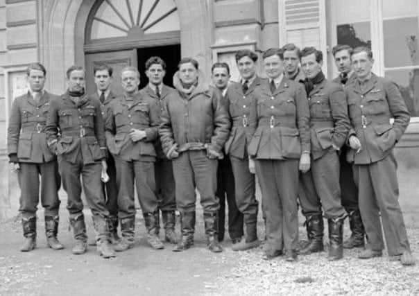 Flying Officer Billy Drake (left) with fellow-officers from No 1 Squadron outside their mess at Neuville-sur-Ornain, France in 1940