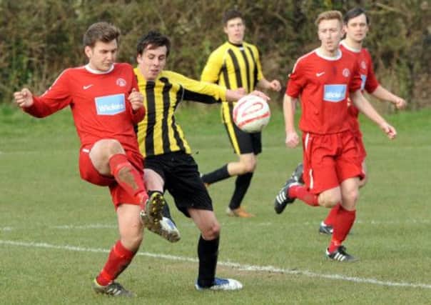 Action from Bosham's home clash with Hunston Community Club  Picture by Kater Shemilt