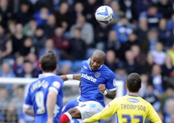 Therry Racon goes up for a header during Pompey's 2-0 win over Bury on Saturday    Picture: Ian Hargreaves