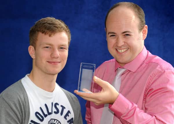 Pointless contestant, Graham Panton (holding trophy) and student Alex Strange who made him apply for show.