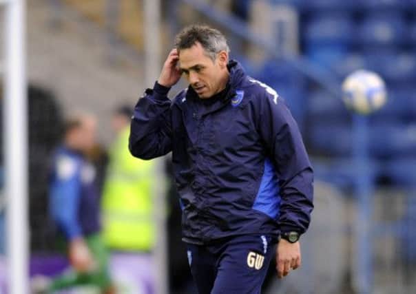 Guy Whittingham has been eager not to see Pompey live beyond their means again