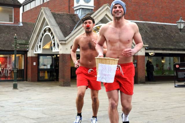 JPCT 150313 13120238x Bare chested runners in a chilly Horsham Carfax. Red Nose Day. Zane Fitzgerald and Ben Davie -photo by Steve Cobb