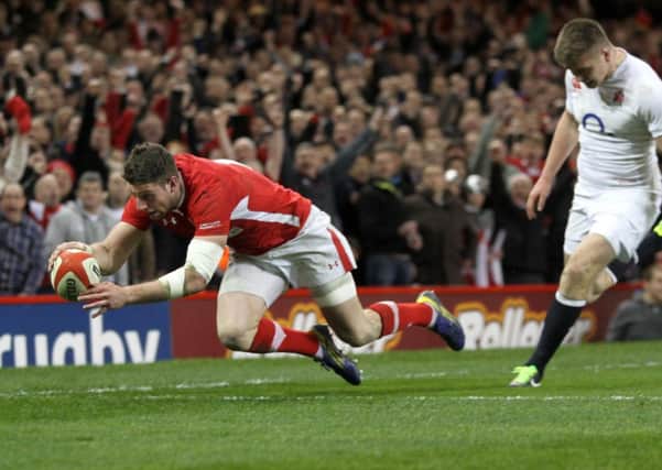 Wales Alex Cuthbert goes over for the first try of the match during the RBS Six Nations match at the Millennium Stadium, Cardiff. PRESS ASSOCIATION Photo. Photo credit: David Davies/PA Wire.