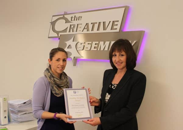 Emma Cole, recruitment and HR assistant at The Creative Assembly, receiving the Horsham Healthy Workplace Award from Cllr Sue Rogers, Horsham District Councils cabinet member for a safer and healthier District - picture submitted
