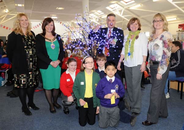 Youngsters at the eco-tree with Southern Co-operatives Gemma Lacey, Littlehampton mayor Emma Neno, East Worthing and Shoreham MP Tim Loughton, E.Y.E Project co-ordinator Polly Wise and communications liaison manager Sarah Hopkins