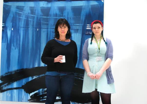 Artist Fran O'Neill and  Foundation Degree in Fine Arts student, Amelia Kirk-Harkin who helped set up the exhibition at Sussex Coast College