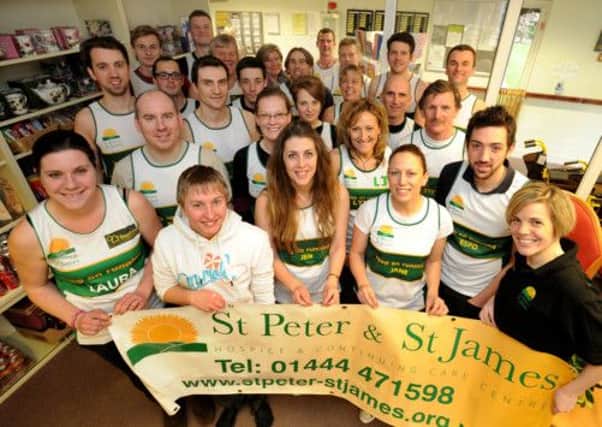 St Peter & St James Hospice hand out running shirts for the Brighton & London Marathons. Photo Steve Robards