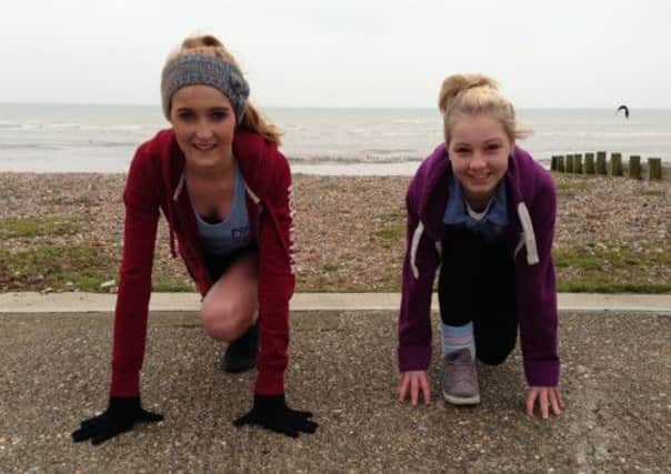 Abby Lane,15, and Stevie Winter-Parker,14, prepare for their epic 10k charity run in Littlehampton to wrap-up their school's week-long set of fund-raising events.