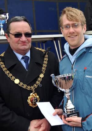 Dean Lacy receives the runner-up trophy from Hastings Mayor Cllr Alan Roberts. Picture by Steve Hunnisett