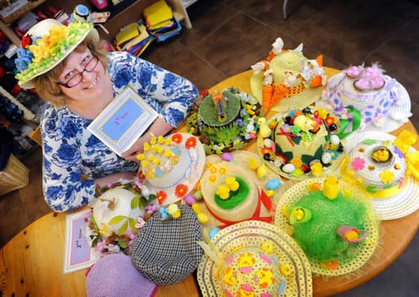 JPCT 260313 S13130118x Horsham. Knitters Corner, Frances Rocks with knitted Easter hats -photo by Steve Cobb