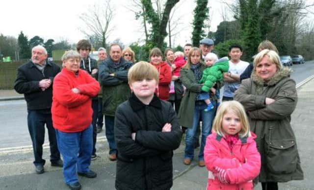 Residents in Hillbarn Lane by the trees that were cut down