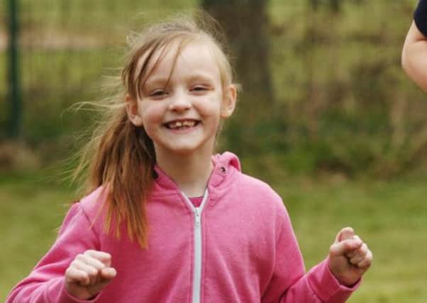 All smiles . . . Remarkable disabled girl Sophie Nugent at the start of her charity run which raised more than £3,000
