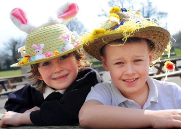 JPCT 280313 S13140173x Easter celebrations. St Mary's Primary school Pulborough. Sean,7, and Jimmy,6, with their Easter bonnets -photo by Steve Cobb