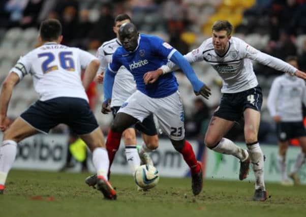 Patrick Agyemang battles away for Pompey at former club Preston   Picture: Joe Pepler