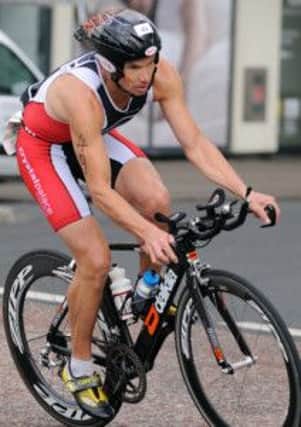 A competitor tackles the bike leg in last year's Bexhill Lions Club Triathlon. Picture by Tony Coombes Photography