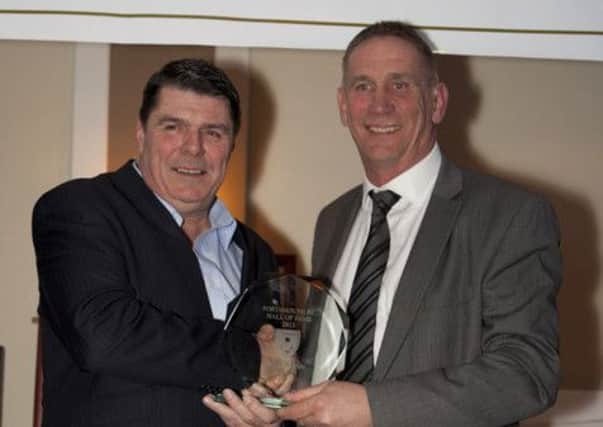 Mick Quinn receives his Pompey Hall of Fame gong from Alan Knight. Picture: horndeanphotography.co.uk